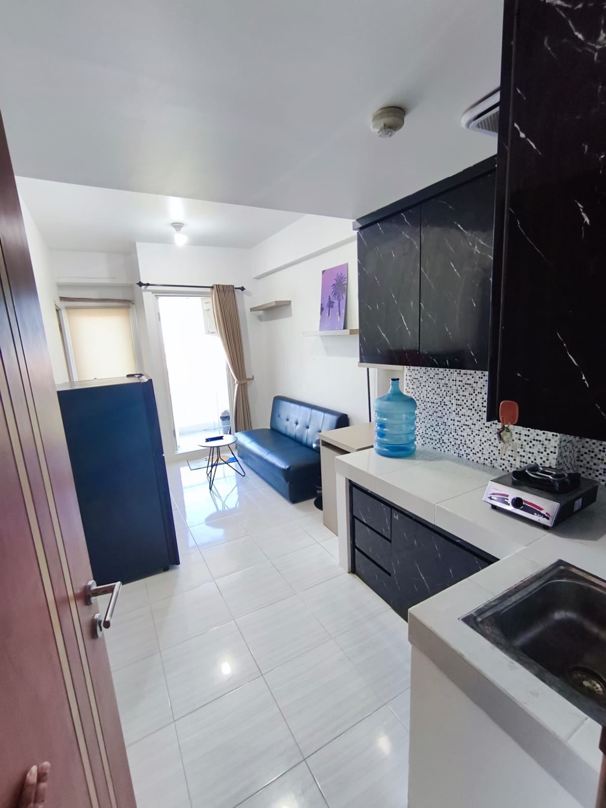 Disewakan Unit Apartemen 2BR di Puncak CBD Lokasi Strategis Surabaya Barat - Image 1